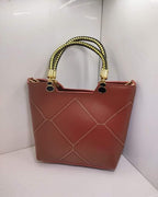 Leather X pattern handbag